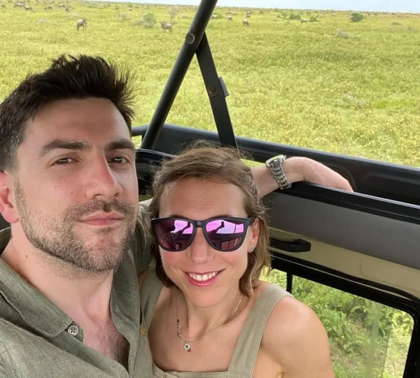 Picture a honeymoon couple from Kale Voyage enjoying their time on the vast Serengeti plains.