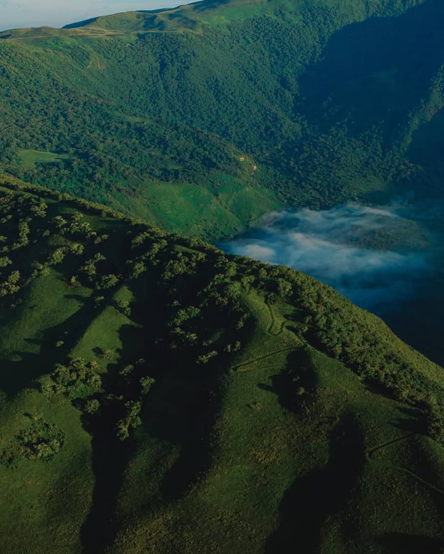 Empakai Crater, located in Tanzania's Ngorongoro Highlands, is a stunning volcanic caldera with a deep alkaline lake at its center